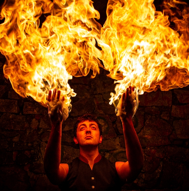 Danny the Fire Performer wields fire in his hands