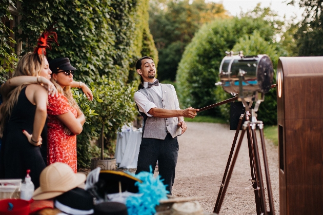 Wedding guests posing with props for a photo booth shot